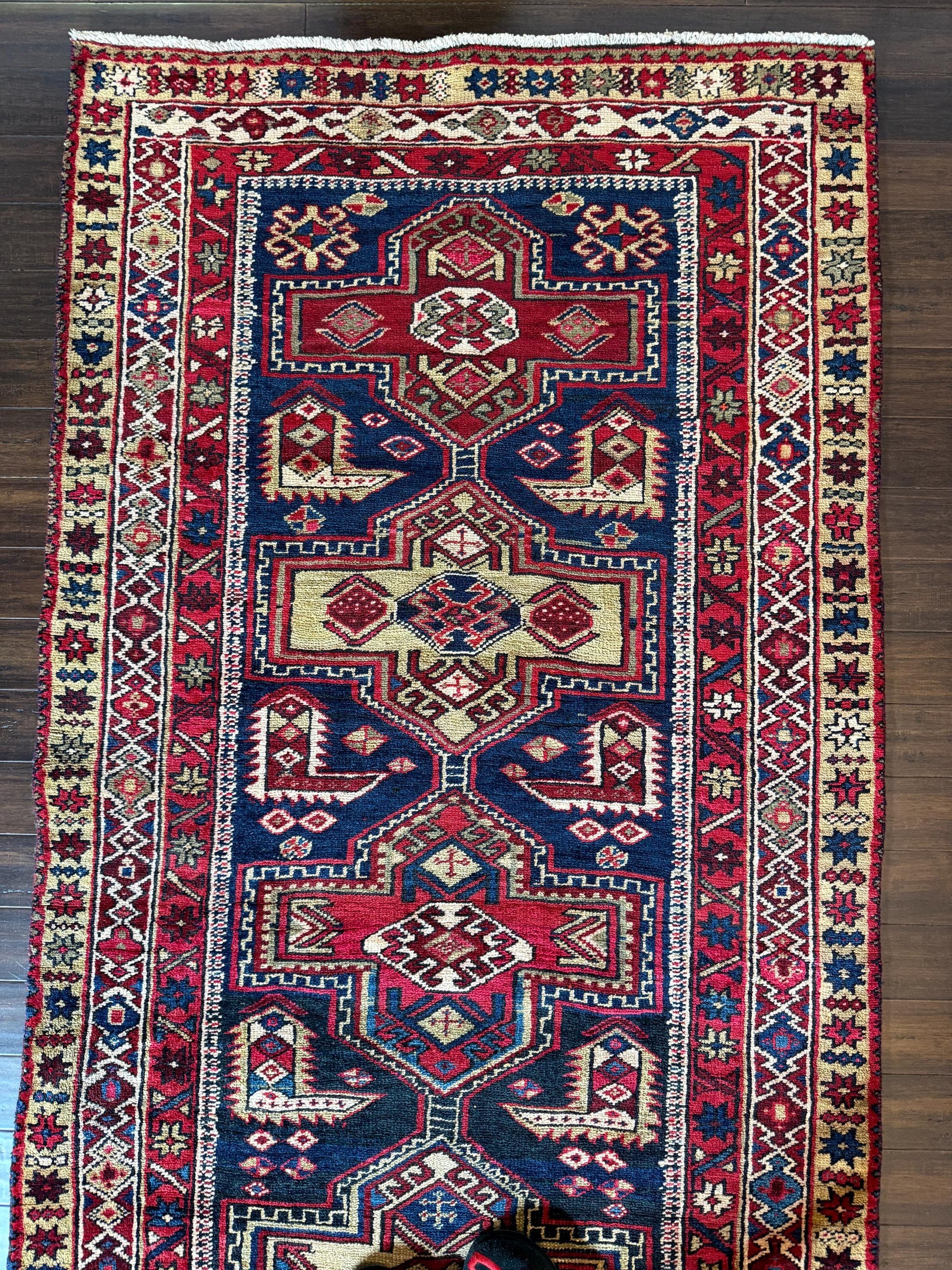 4x11 ft Vintage 1980s Tribal Heriz Runner Rug: Hand Knotted Wool Design