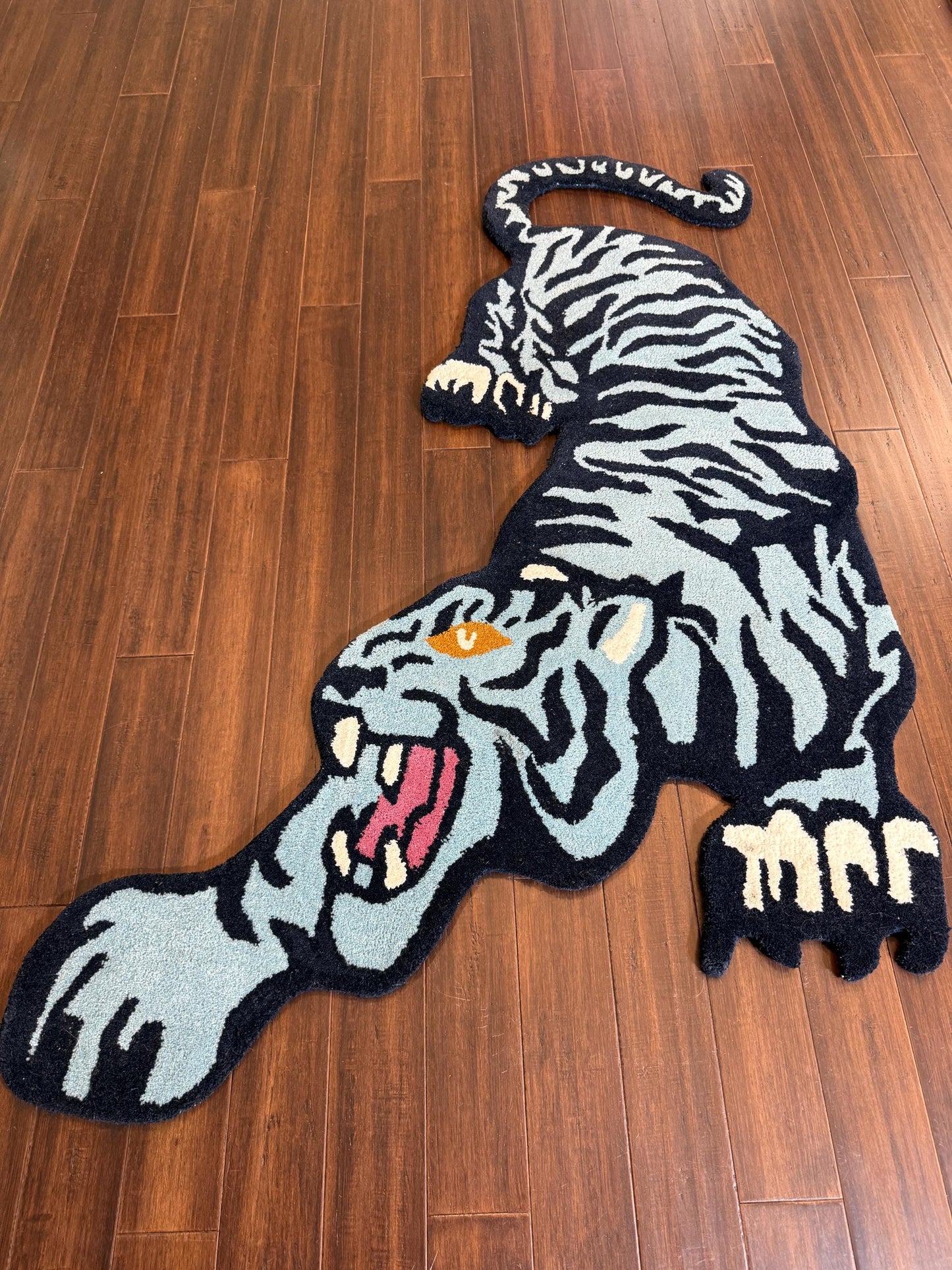 tiger area rug
jungle animal decor
hand tufted rug
tiger nursery rug
oriental tiger rug
tiger print rug
safari animal rug
artisan wool rug
tiger floor mat
bold animal rug
jungle theme rug
exotic wool carpet
tiger home decor
wild animal rug
handmade floor rug
Turkish novelty rug
statement area rug
boho jungle decor
jungle inspired rug
wildcat rug
tiger room decor
luxury wool rug
Turkish crouching tiger
tiger shape rug